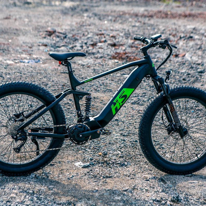 EUNORAU E-BIKE US FAT-HS electric bicycle with thick tires and black frame, shown from side view on a paved path.