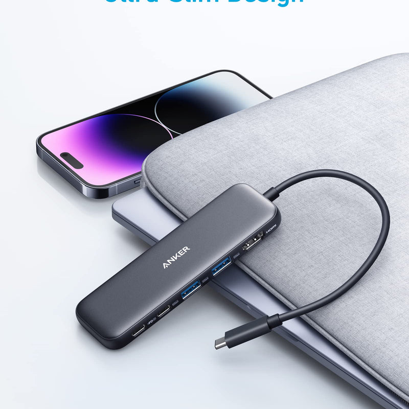 Anker 332 USB-C Hub 5-in-1 in black showing multiple ports including HDMI, USB-A, and SD card slot on a sleek design.