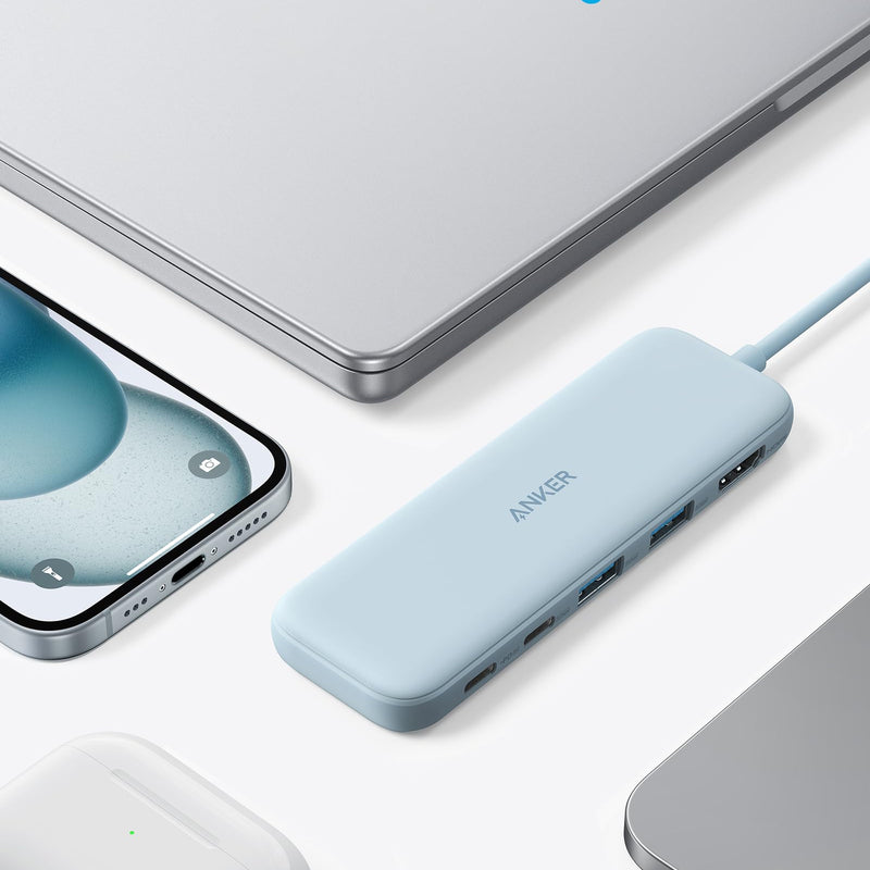 Refurbished Anker 332 USB-C Hub 5-in-1 with multiple ports, black compact design, connected to a laptop.