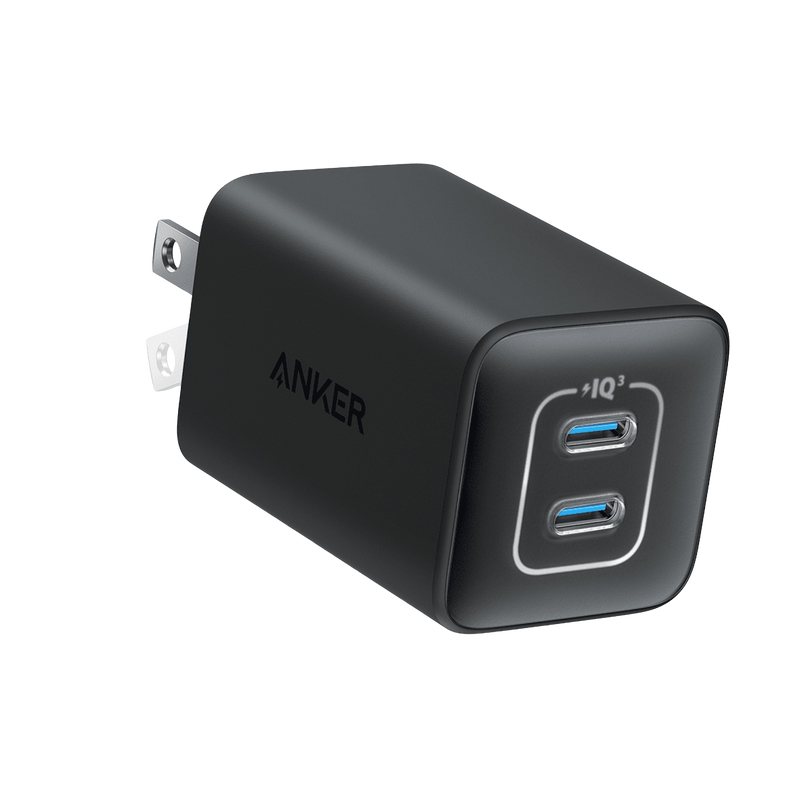 Anker 523 Nano 3 47W charger in black with compact stone design, shown with USB-C port for fast device charging.