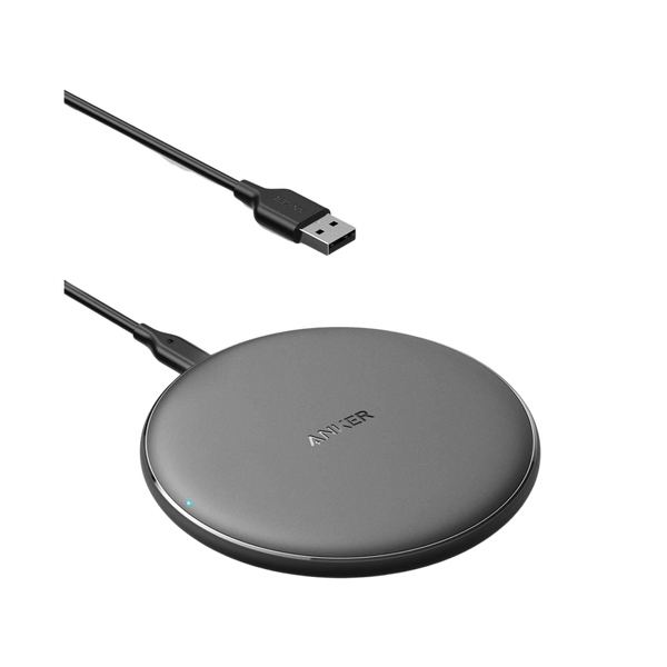 Black Anker 313 wireless charging pad for charging devices, with a sleek, flat design suitable for home or office use.