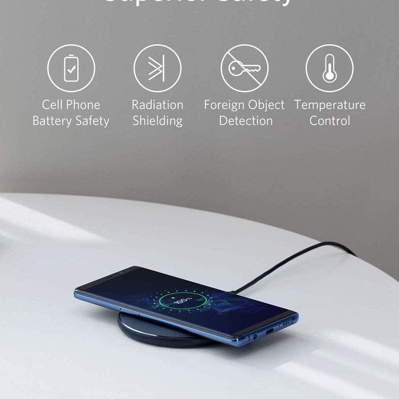 Anker 313 wireless charging pad in black for charging compatible smartphones wirelessly on a sleek, minimalist pad.