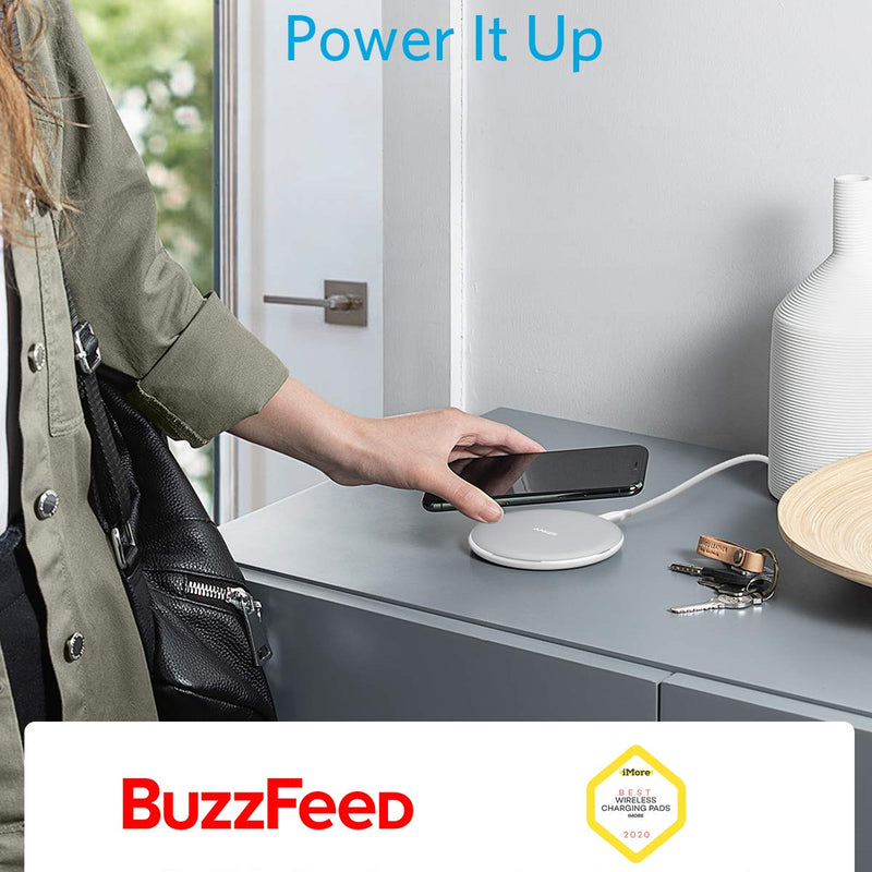 Anker 313 wireless charging pad in black, designed for charging compatible devices wirelessly on a sleek, flat pad.