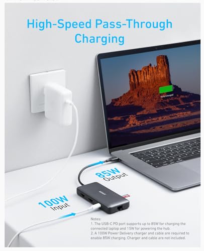 Anker 553 USB-C Hub in black showing multiple ports for charging, including USB-C, USB-A, HDMI, and SD card slots.