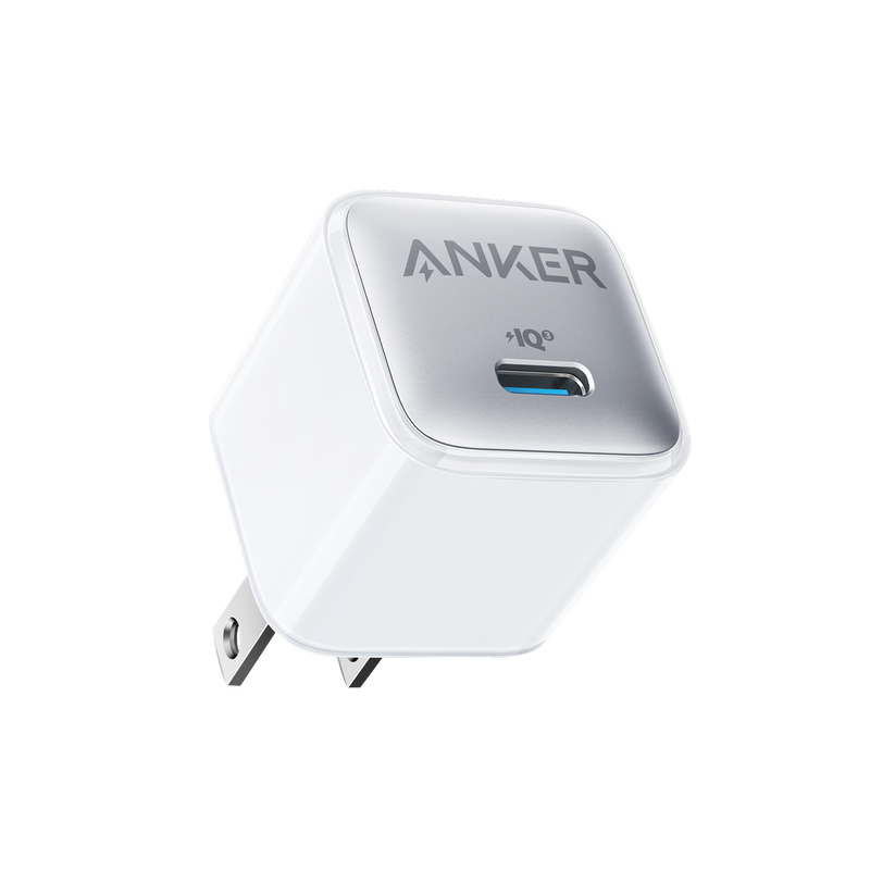 Anker Nano 20W charger in black, compact design for fast charging electronic devices, shown plugged into a power outlet