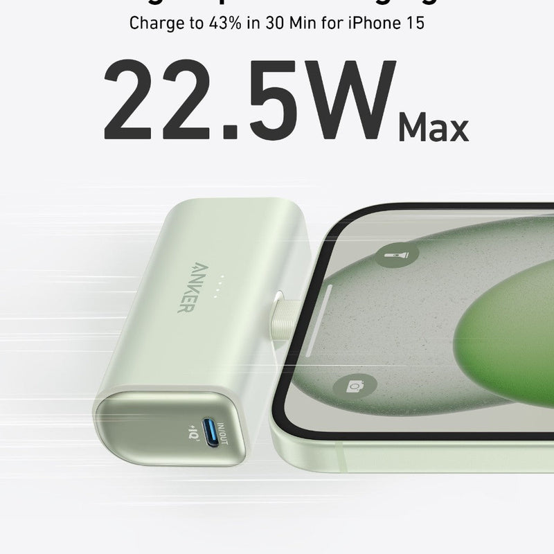 Anker Nano Power Bank in black with built-in USB-C connector, 22.5W portable charging device on a stone surface.