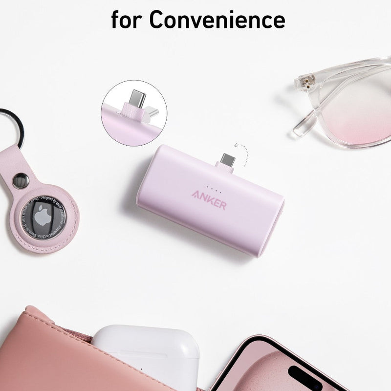 Anker Nano Power Bank in black with built-in USB-C connector, 22.5W portable charging device on a flat surface.