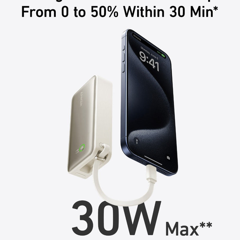 Anker Nano Power Bank in black with built-in USB-C cable, 30W portable charging device on a stone surface.