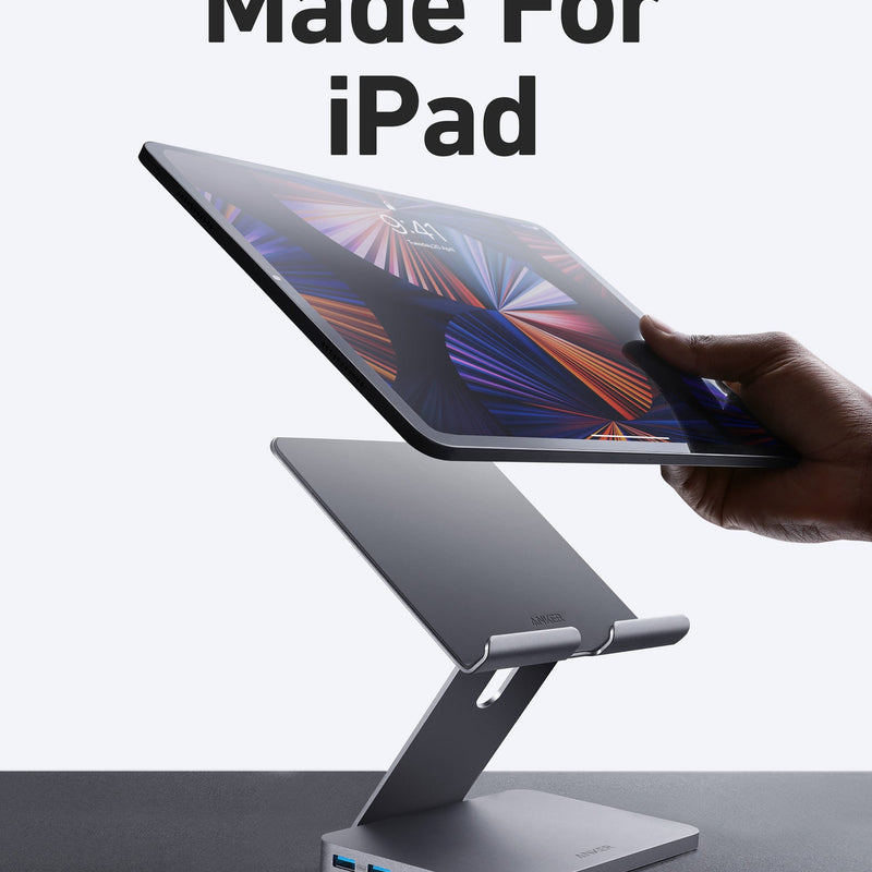 Anker 551 USB-C Hub in gray showing multiple ports with a built-in tablet stand for charging and connectivity.