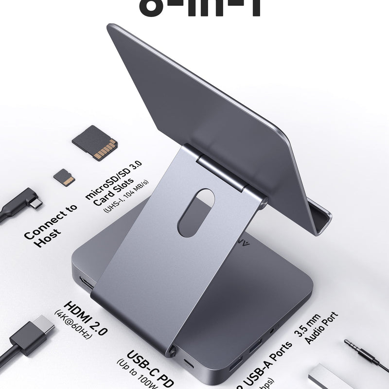 Anker 551 USB-C Hub in gray with multiple ports and integrated tablet stand, designed for charging and connectivity.