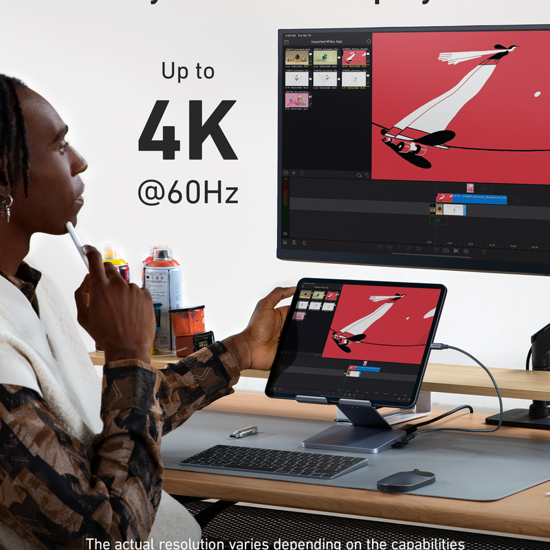 Anker 551 USB-C Hub in gray showing multiple ports for charging and connectivity, with a built-in tablet stand.