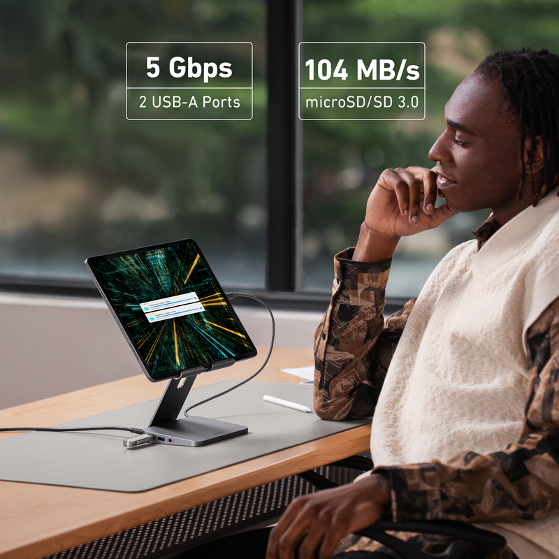 Anker 551 USB-C Hub in gray showing multiple ports and a tablet stand, designed for charging and connectivity for tablets and laptops.
