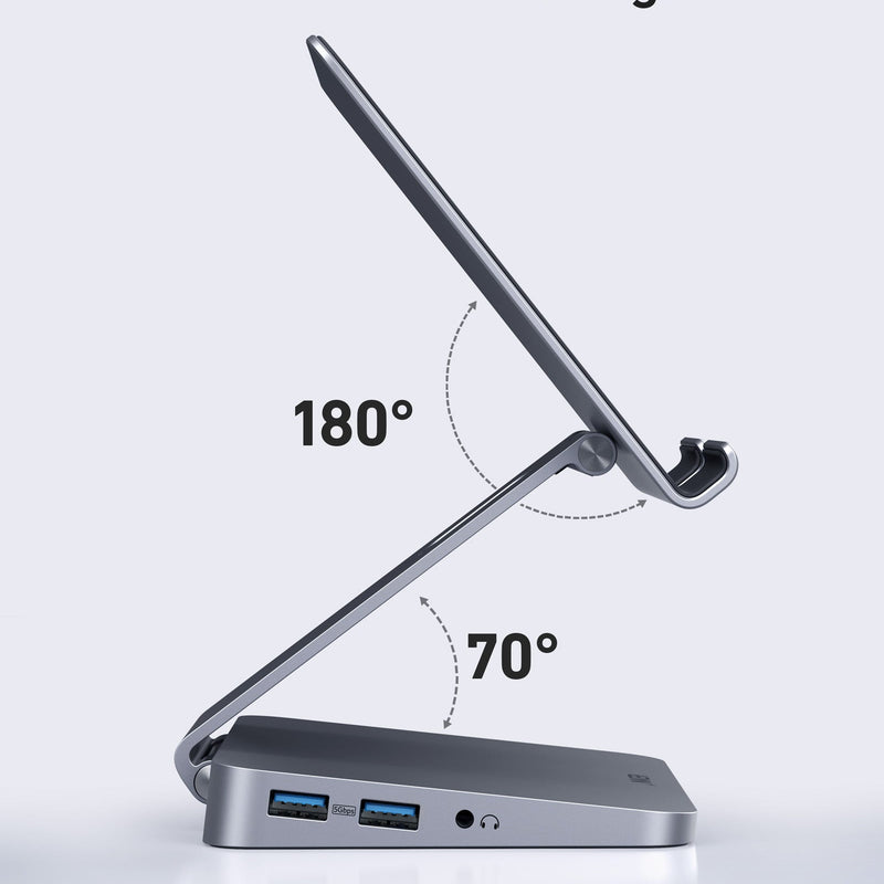 Anker 551 USB-C Hub in gray with 8 ports, designed for charging and tablet stand functionality, shown with connected devices.