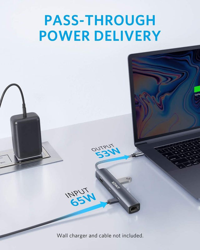Anker 543 USB-C Hub in grey showing six ports for charging and connectivity, slim design ideal for laptop use.