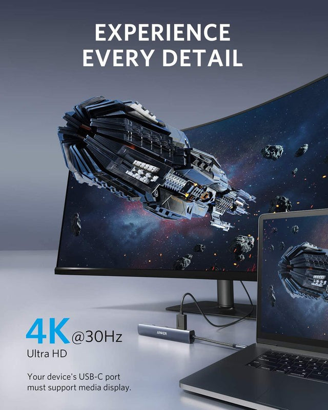 Anker 543 USB-C Hub in grey, slim 6-in-1 charging-only hub with multiple ports for device connectivity.
