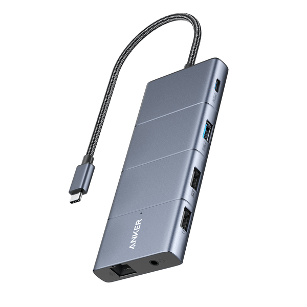 Anker 565 USB-C Hub in grey showing multiple ports for charging and connectivity in a close-up view