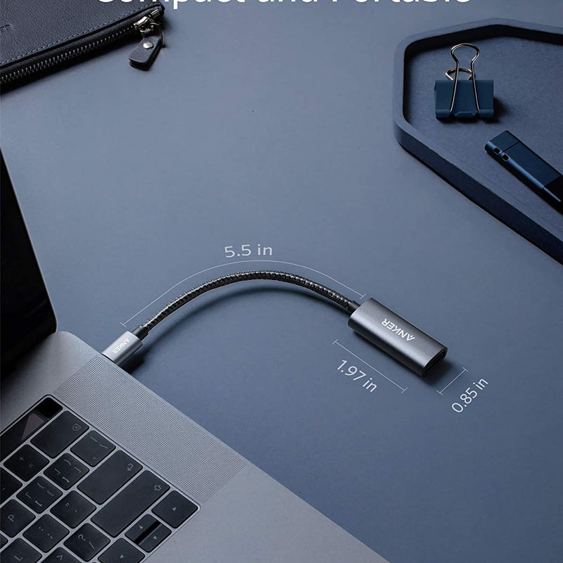 Anker PowerExpand USB-C to DisplayPort adapter connected to a laptop for high-resolution video output.