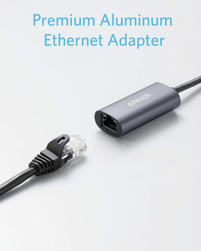 Anker PowerExpand USB-C to Gigabit Ethernet Adapter connected to a laptop for fast wired internet access.