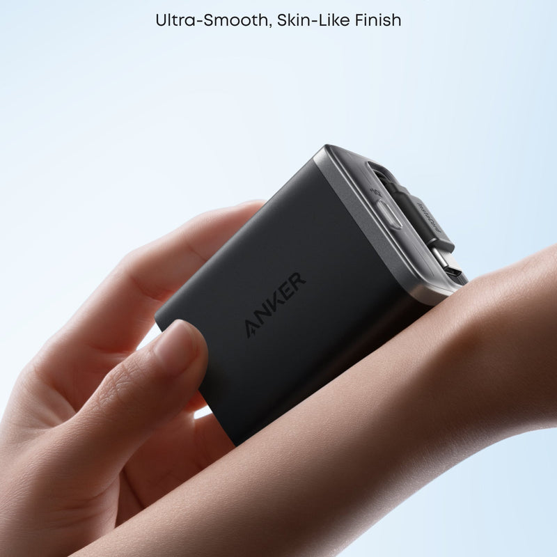 White Anker Nano Charger with 35W power and built-in retractable USB-C cable for fast charging and easy portability.