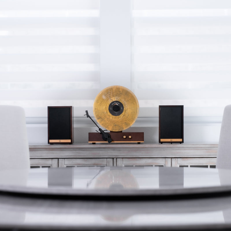Fuse Audio GLD Vertical Vinyl Record Player turntable with gold finish, showcasing a sleek vertical design and tonearm details.